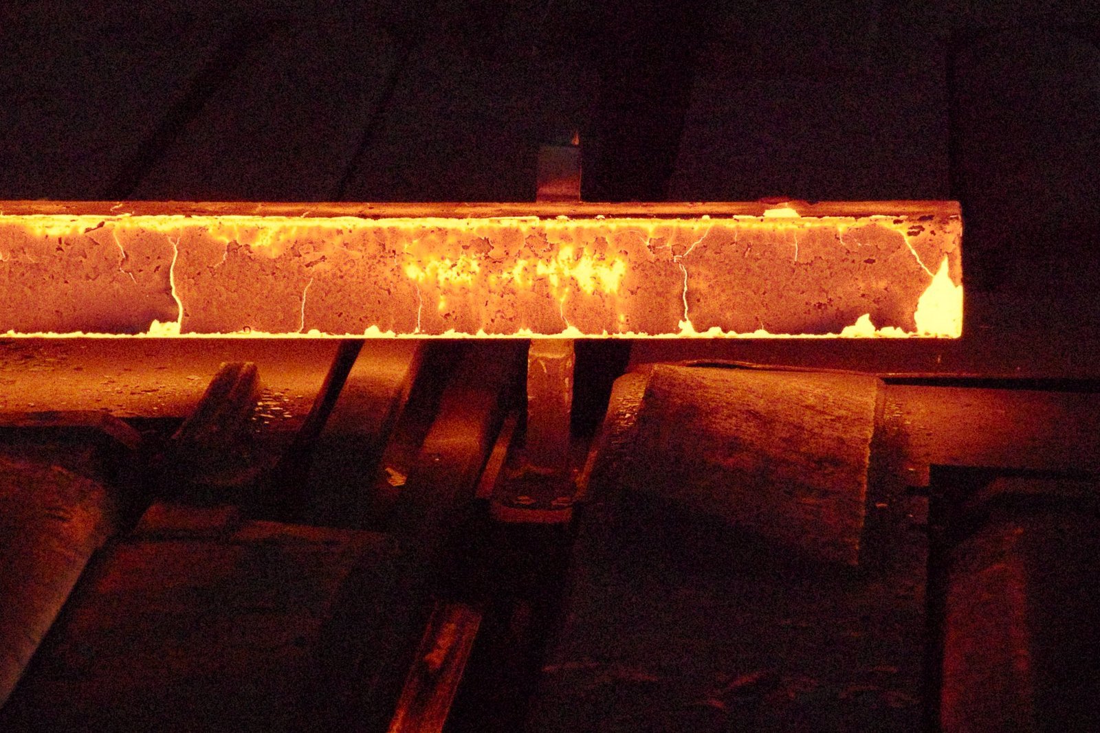 Hot steel moving through a rolling mill